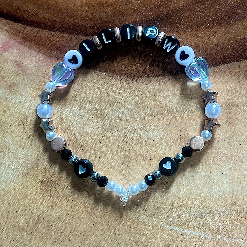 Taylor Swift Handmade Friendship Beaded Bracelet
“I Look In People’s Windows”